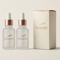 Two Beaurei skincare bottles with a matching box on a light beige background